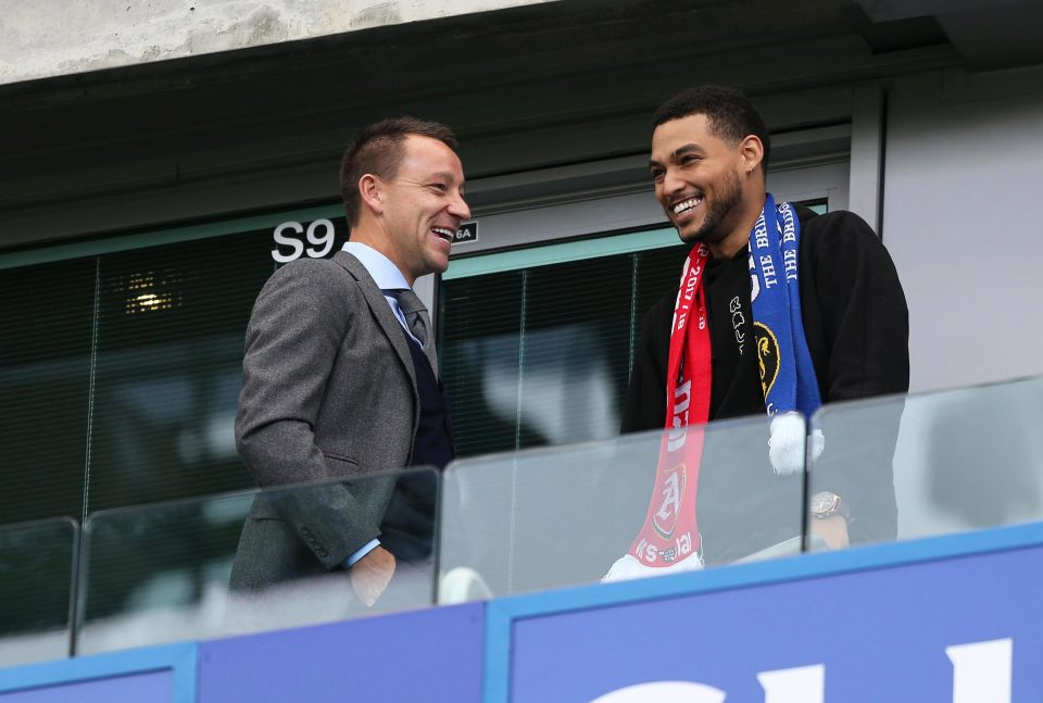  Terry chatting with a guest in the box before the game