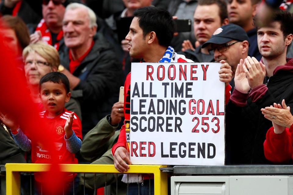  And inside fans held up signs for Rooney