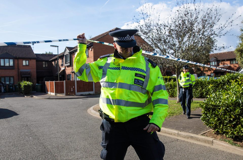  Officers are seen at the cordon around the West London property