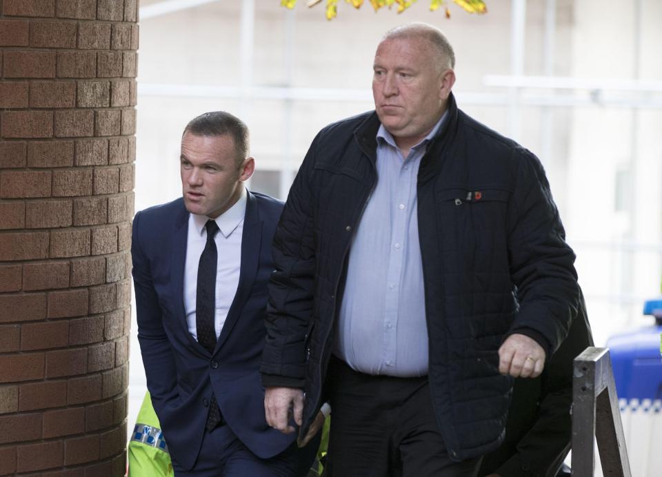  Wayne Rooney arrived at court in a blue suit and tie and a white shirt on Monday