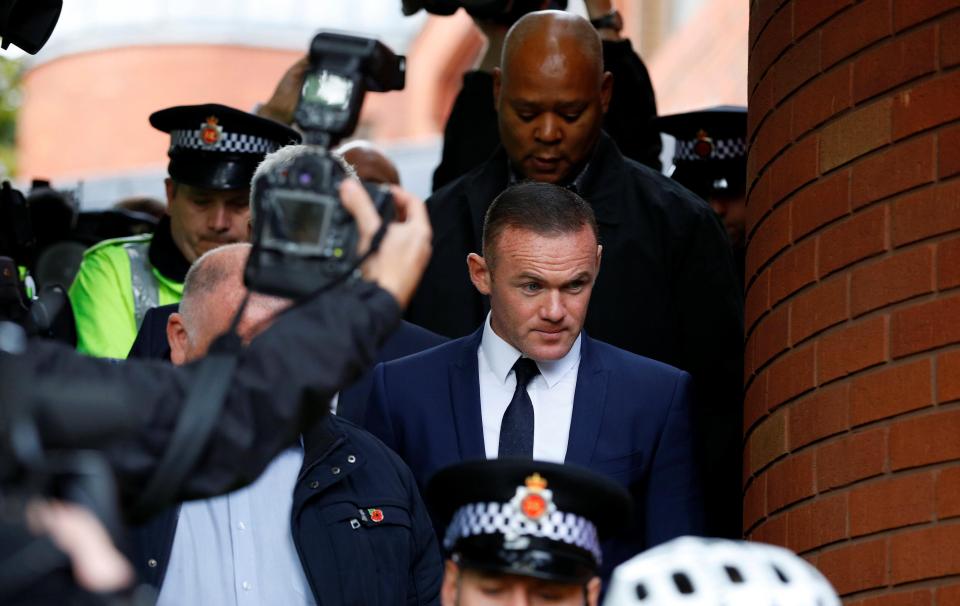  Rooney pictured leaving the court after being banned from driving for two years