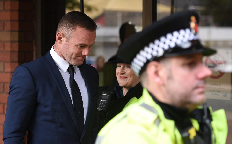  Rooney appear to smile as he left court with a community sentence