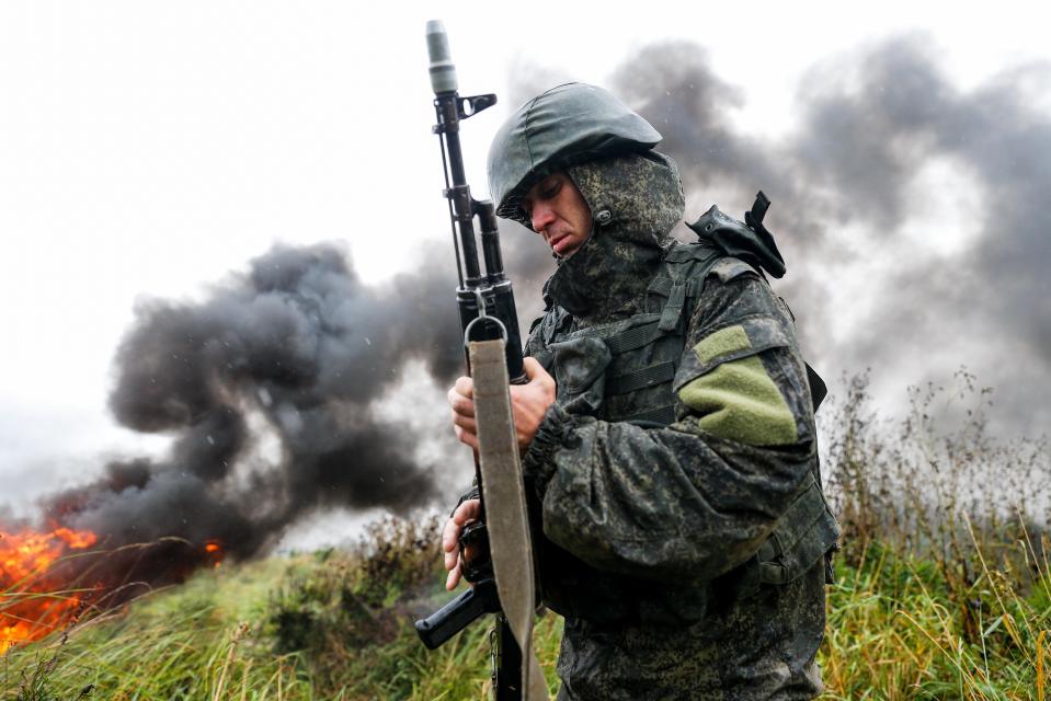  A serviceman of a Russian Baltic Fleet unit checks his weapon