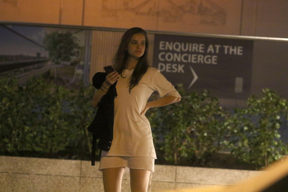 Barbara Palvin waits for a car after emerging from a flat at 5am following several hours with Neymar