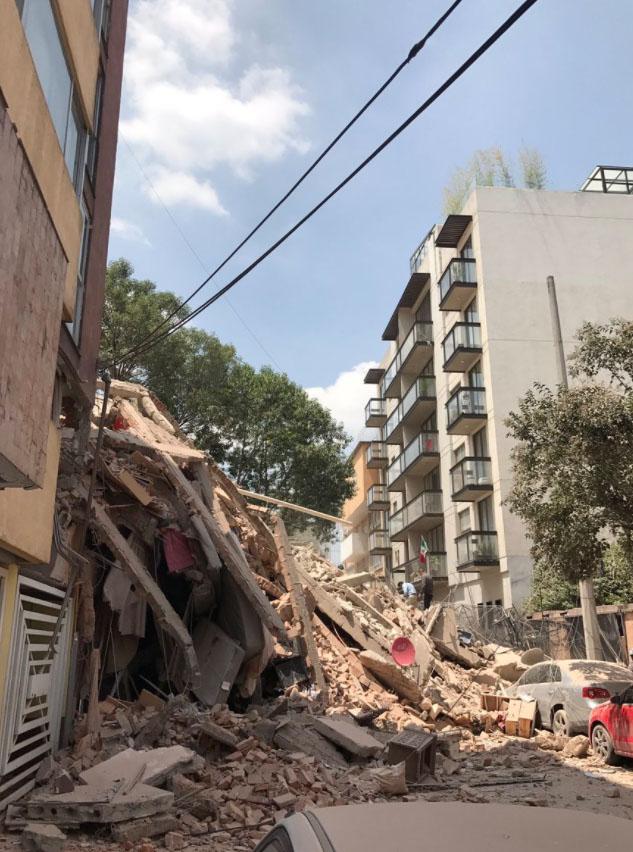 The quake's impact left buildings swaying side to side with some crumbling to pieces