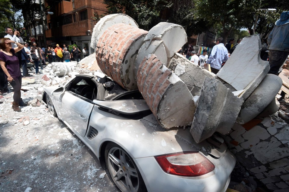 A car was crushed by falling debris from a damaged building 