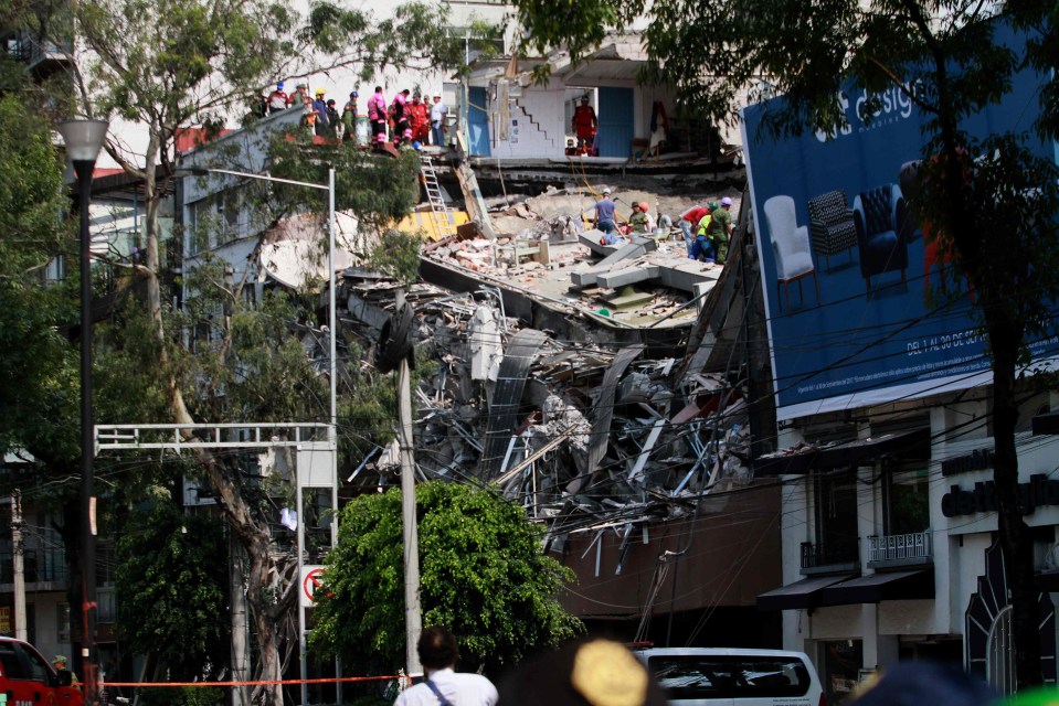 At least 50 people have been pulled alive from the rubble by citizens and rescue workers in the city 