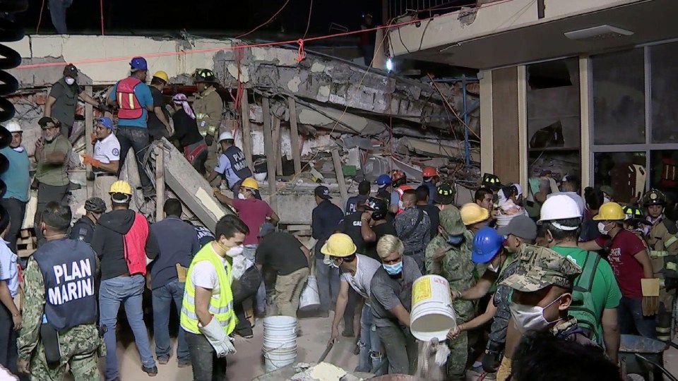 Rescue teams looking for people trapped in the rubble at the Enrique Rebsamen elementary school in Mexico City