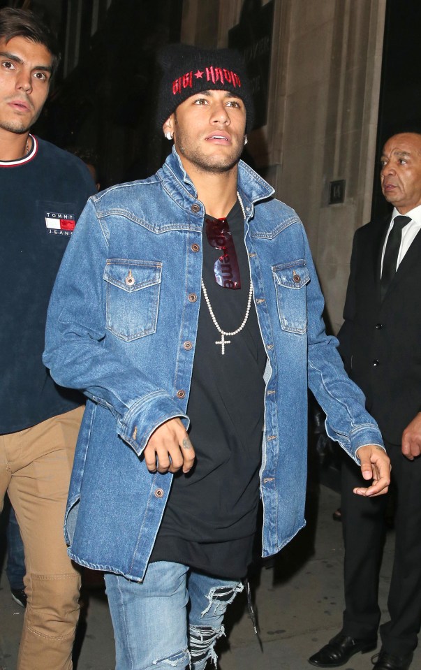 The sports ace looked snug in his matching denim jacket and jeans