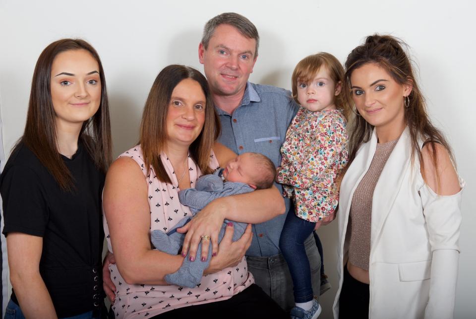  Sue and Noel with their newborn son Archie and daughters Hallie, two, Millie, 16, and Sophie, 23