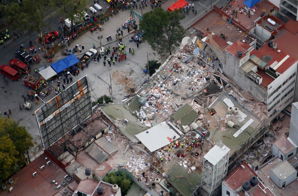 The school collapsed during yesterday's earthquake killing at least 21 children and five adults 