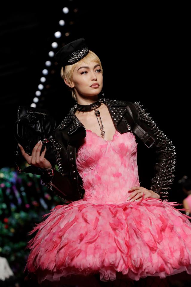  With a punk-style leather jacket and hat teamed with a dress made entirely of feathers