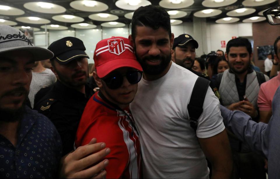  Diego Costa happily posed with delighted fans at the airport