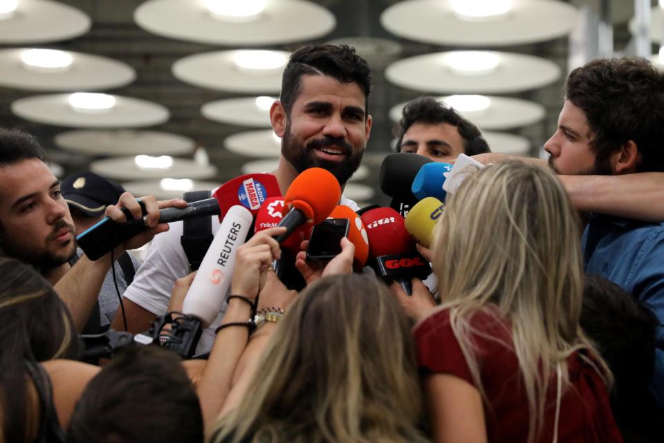  Diego Costa was all smiles as he spoke to the press upon his arrival