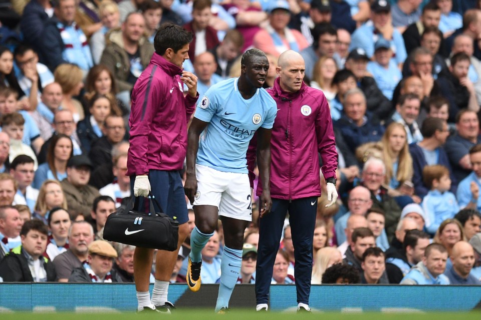 Defender Benjamin Mendy is helped by Manchester City medics