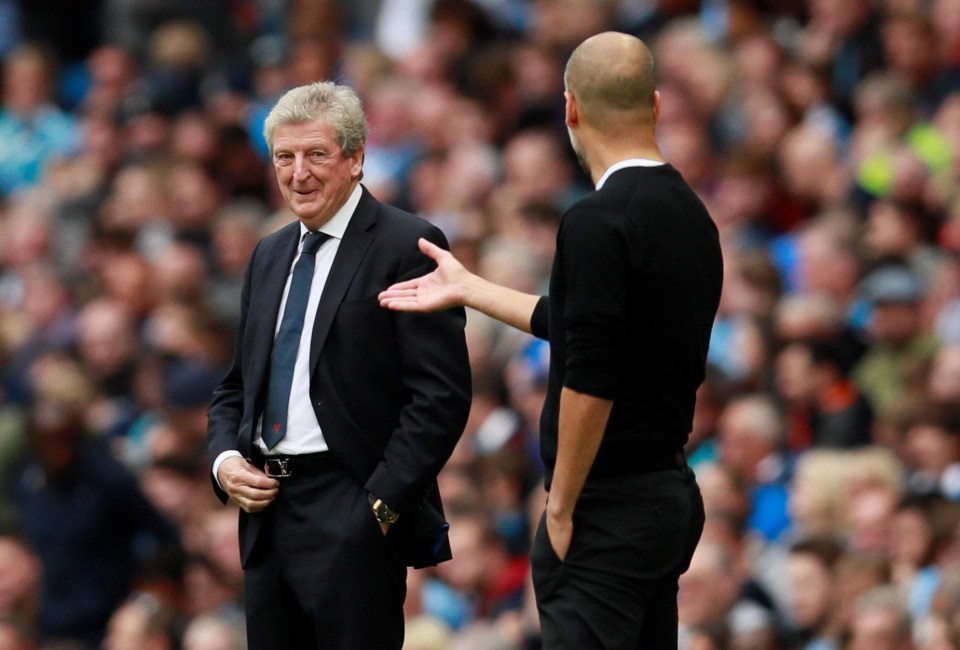 Pep Guardiola and Roy Hodgson share a friendly exchange on the touchline