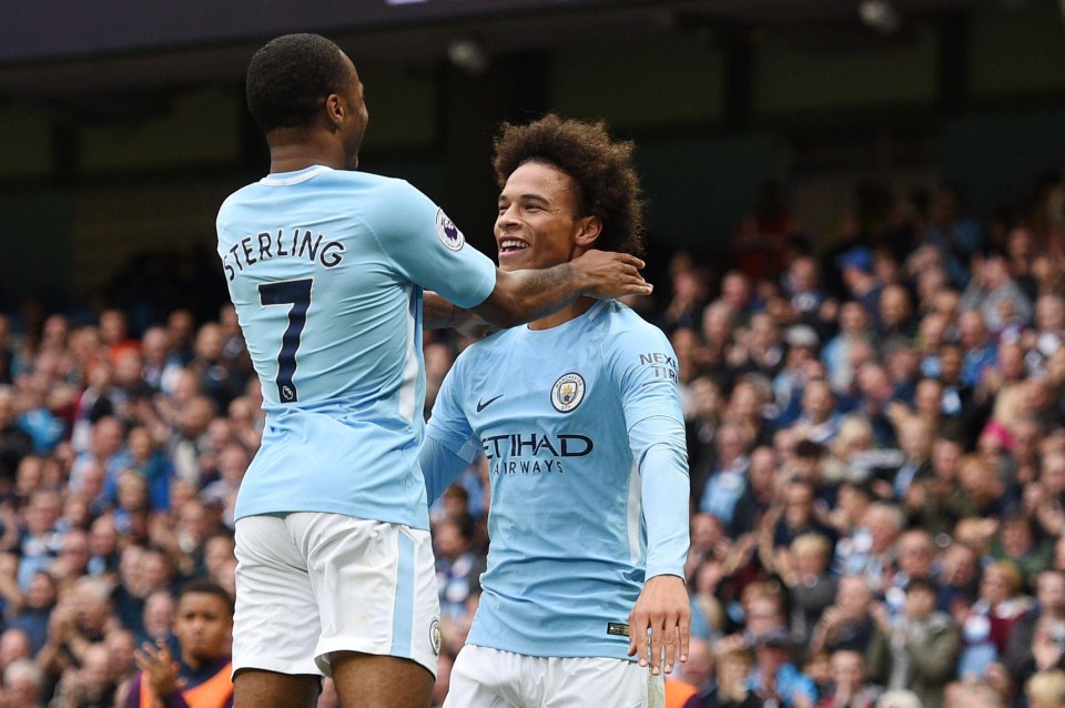 Raheem Sterling and Leroy Sane celebrate after both getting on the score sheet for Manchester City