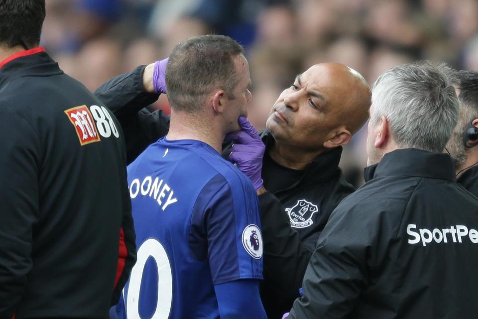  Wayne Rooney was treated on the sidelines at Goodison Park