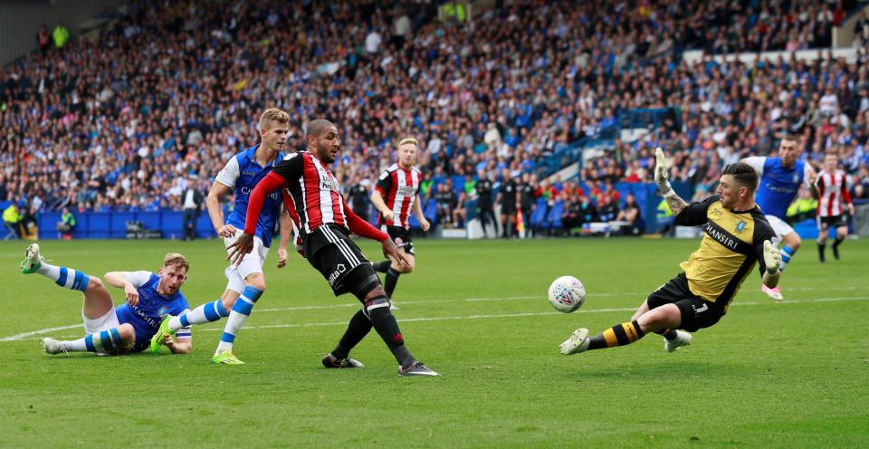  Leon Clarke dinked the ball over the onrushing goalkeeper to seal the points