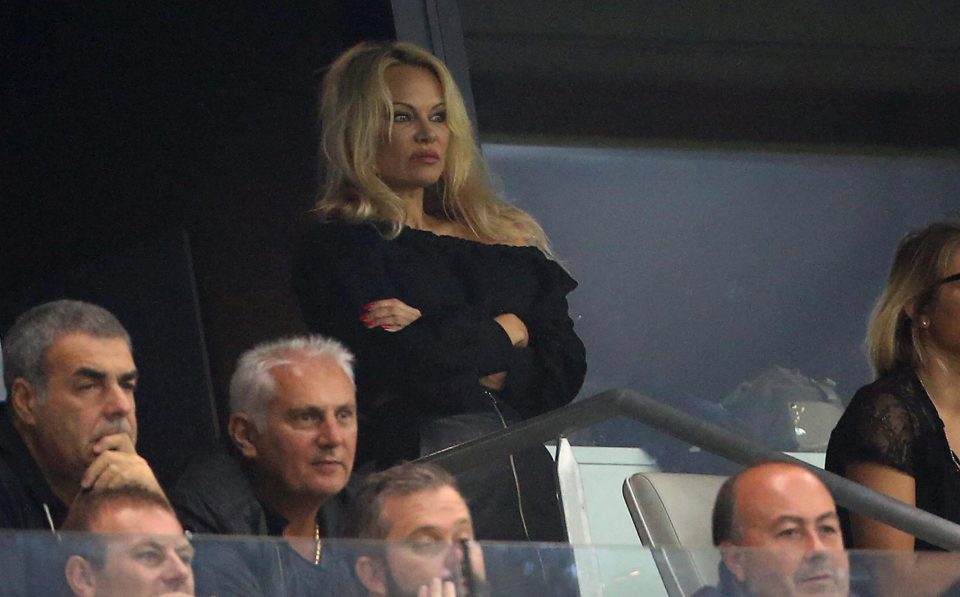  Pamela Anderson looked nervous in the crowd as she cheered on Adil Rami