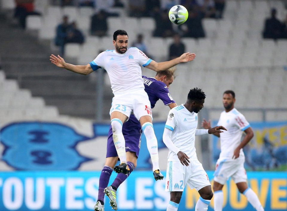  Adil Rami leaps to win a header during Marseille's 2-0 win over Toulouse