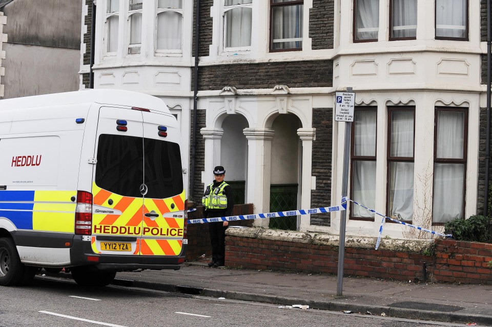 A police officer stands guard outside the Cardiff home where a 20-year-old was arrested this morning in connection with the Parsons Green bomb attack