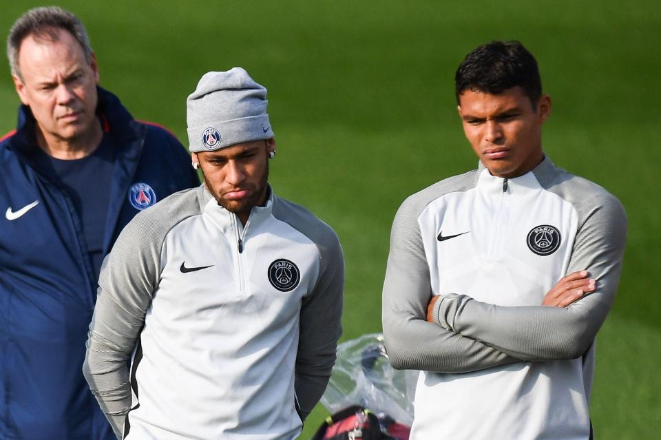  Neymar looks unimpressed next to Brazilian compatriot Thiago Silva