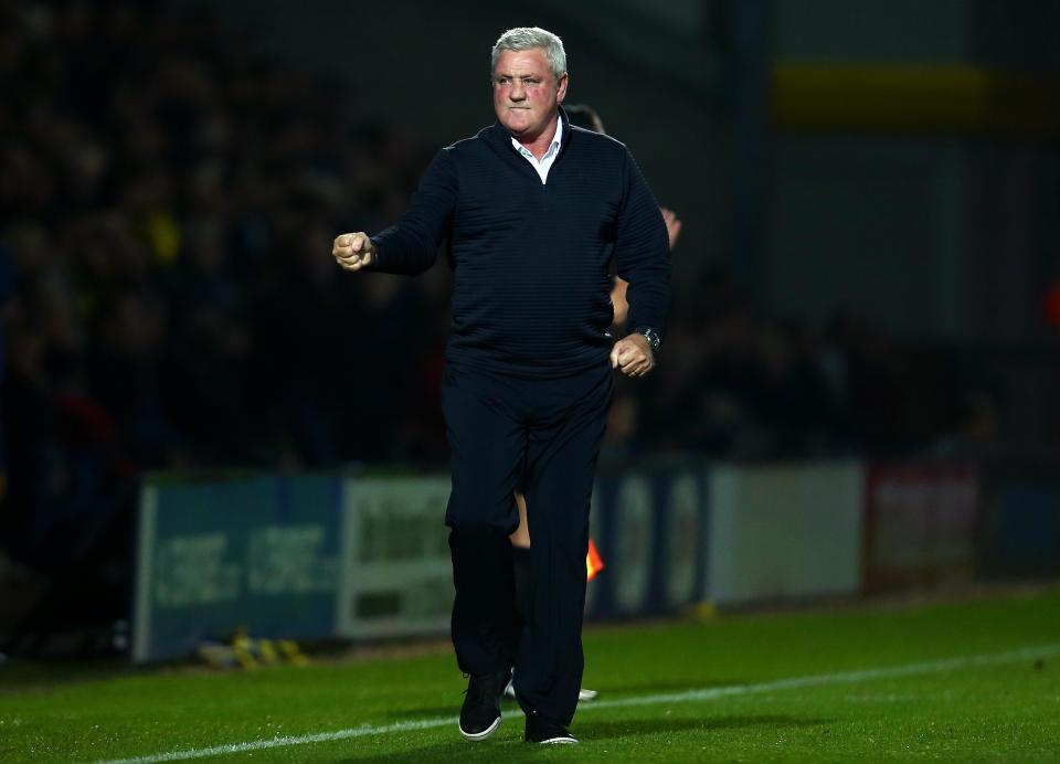 Steve Bruce punches the air as Villa run out 4-0 winners over Burton Albion