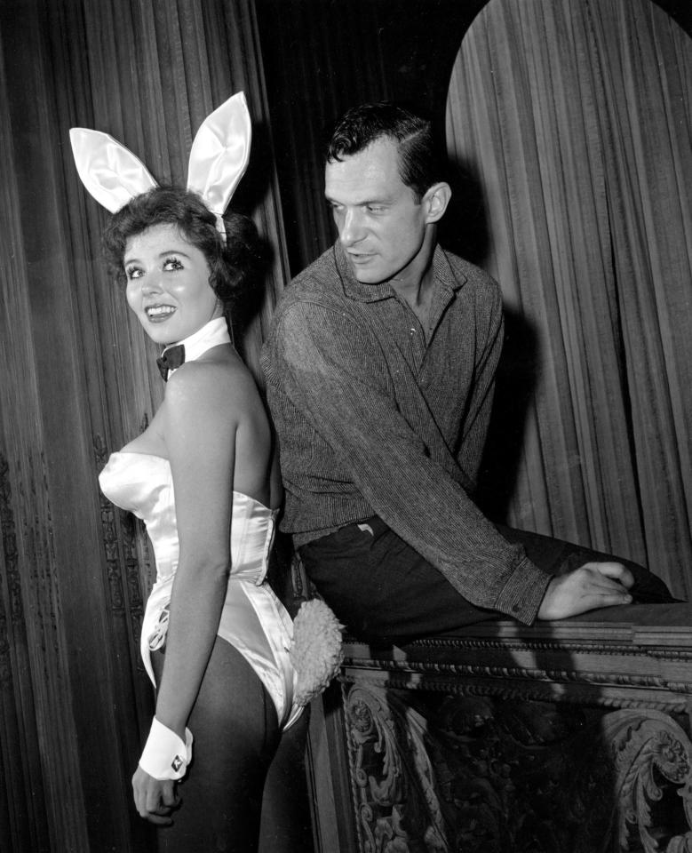  Playboy magazine publisher Hugh Hefner poses with "bunny-girl" hostess Bonnie J. Halpin at Hefner's nightclub in Chicago in 1961