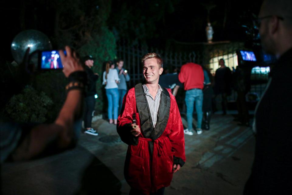  Mason Marie of San Pedro, California gathers with fans of Hugh Hefner at the gate of the Playboy Mansion