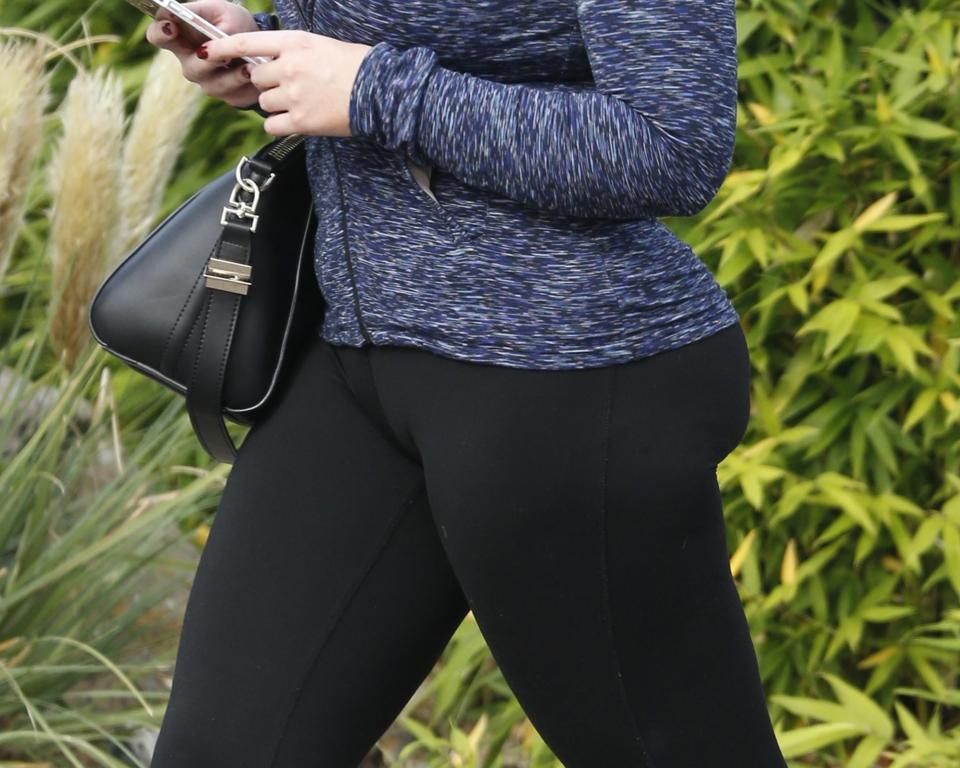  Lauren's skintight trousers showed off her shapely bottom