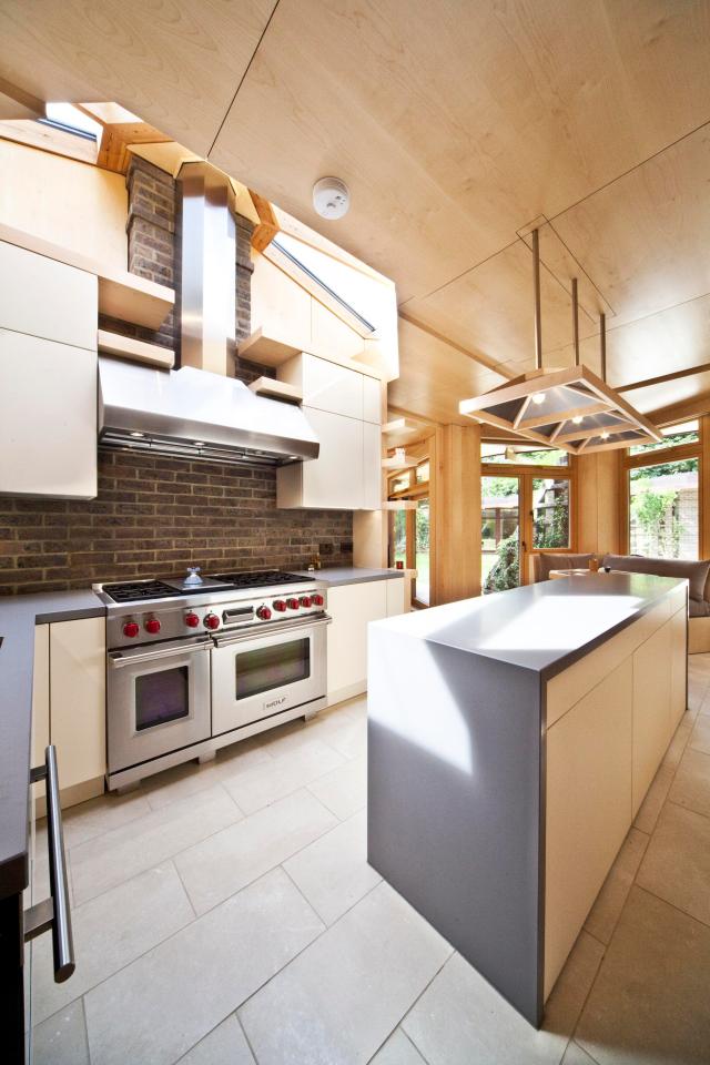  The interior of the one-storey home is clad almost entirely in maple and features bespoke light fittings