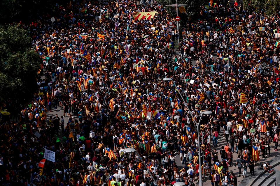  Students wave Catalan flags as they march during a pro-referendum demonstration in Barcelona