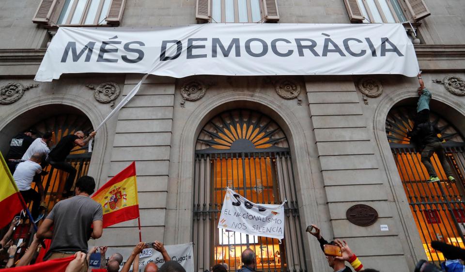  Protesters tore down a banner on the City Hall