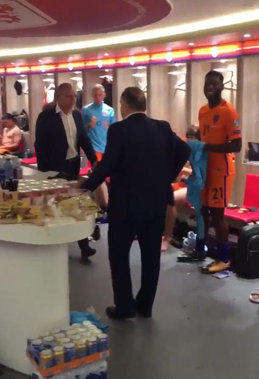  Management chew the cud with Dutch players after the 3-1 win