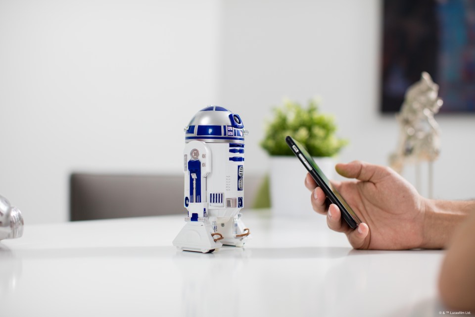 The cute R2-D2 toy is only a little bit bigger than a smartphone