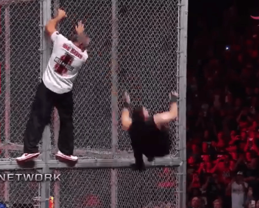  Kevin Owens was pulled off the cage and through a table by Shane McMahon