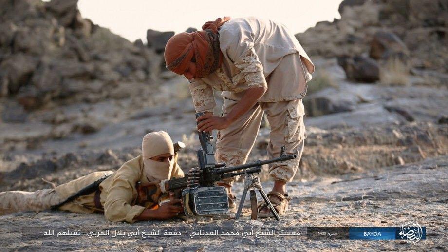 An instructor teaches a recruit how to fire a machinegun