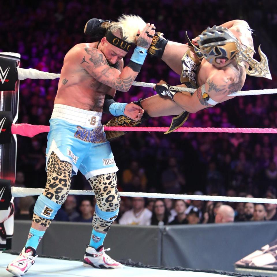  Kalisto hits Enzo with a enziguri