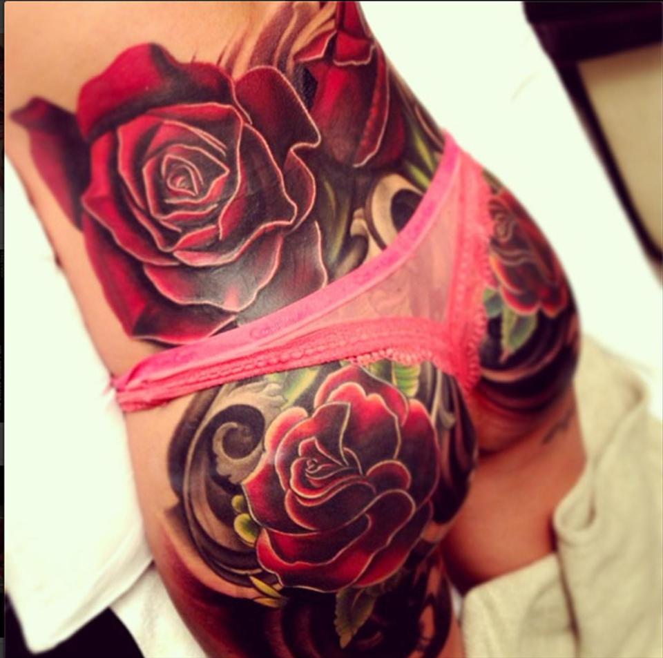  Cheryl's huge rose tattoo has covered up the cartoon bird