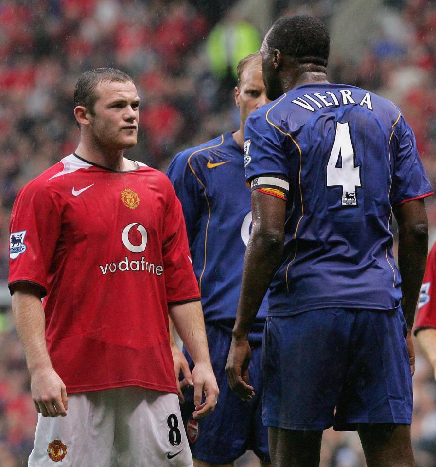  Rooney is surrounded by Arsenal legends Vieira and Bergkamp in heated encounter