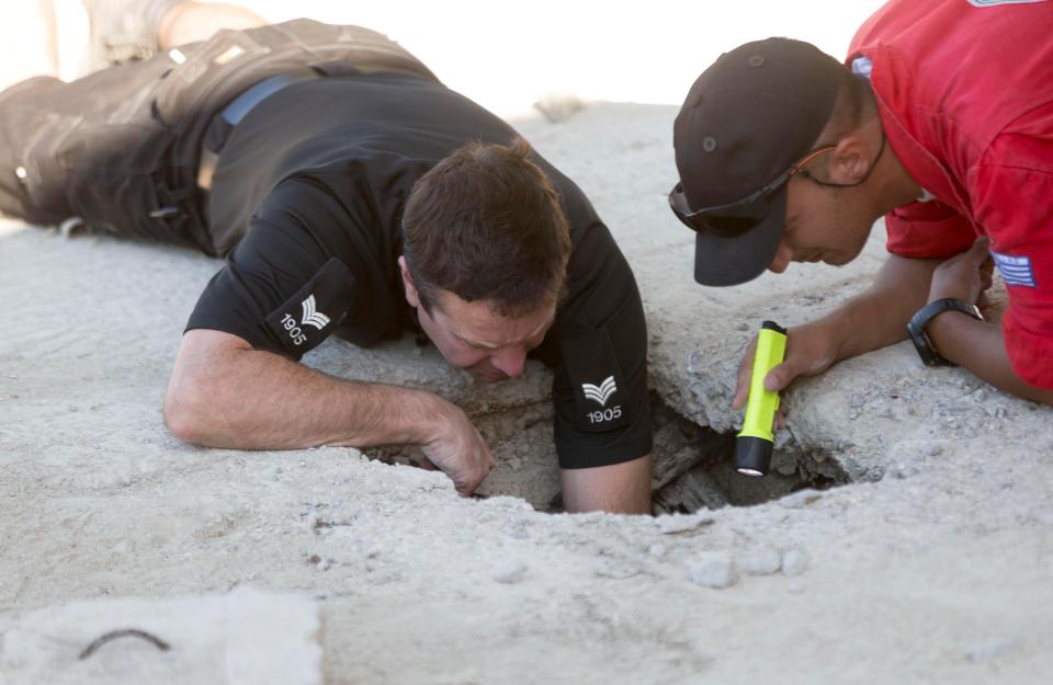  Officers excavate the area where he vanished