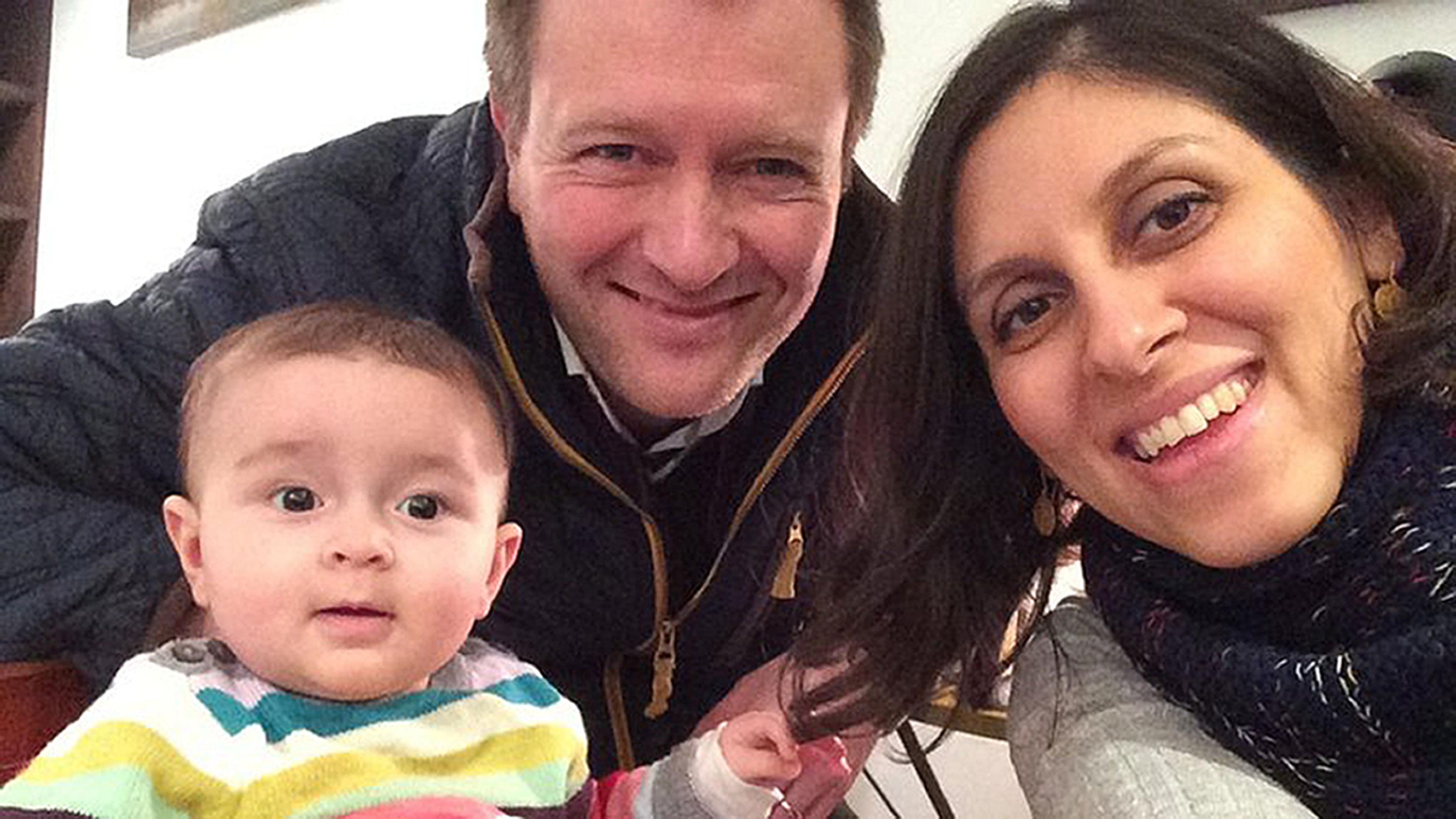 Nazanin Zaghari-Ratcliffe, right, with her husband Richard and daughter Gabriella  Credit: PA:Press Association