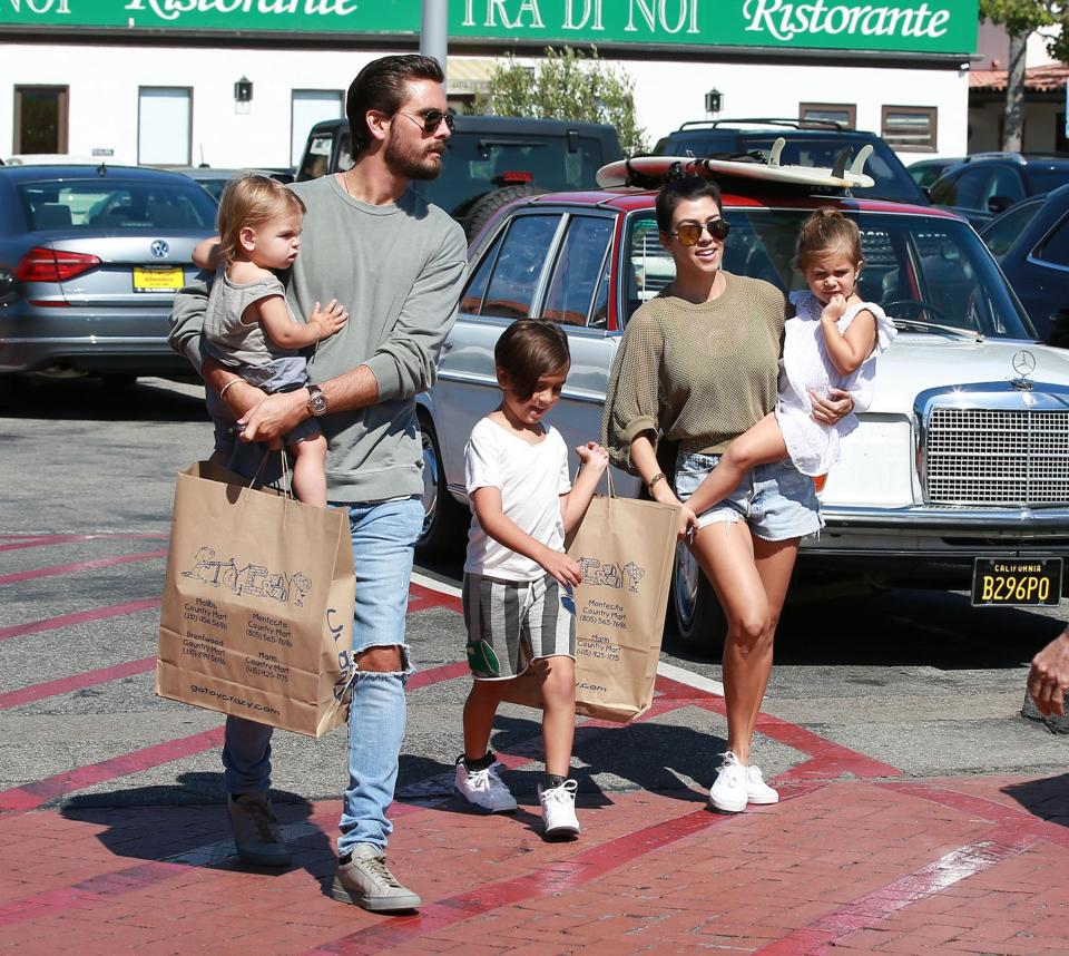  Scott and Kourtney in happier times with their three kids