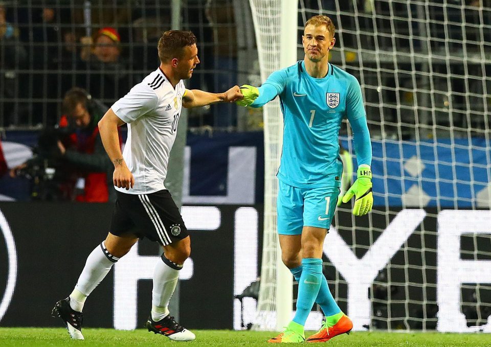  Podolski got a glove punch from England keeper Joe Hart