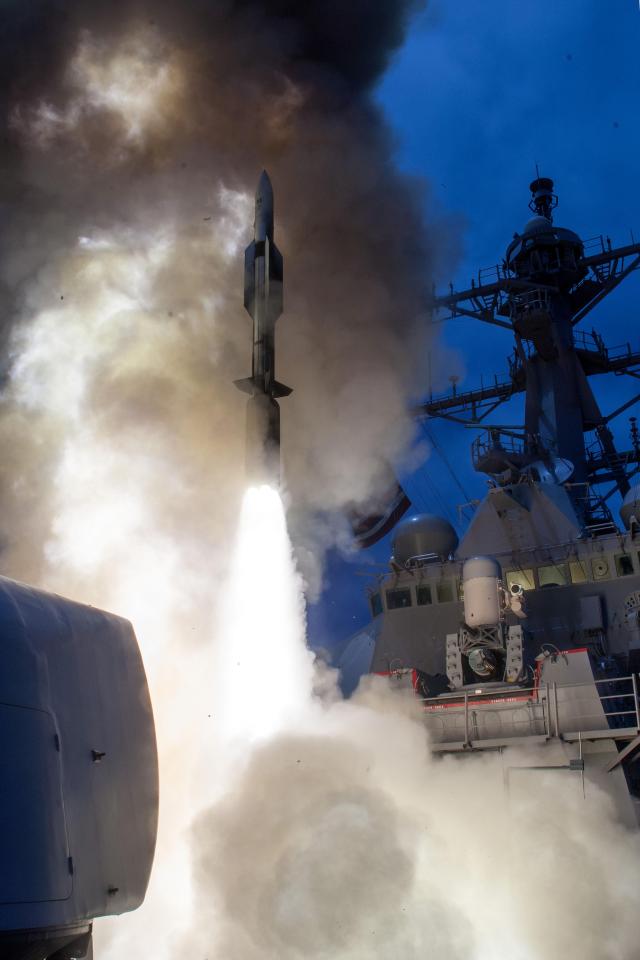  The guided-missile destroyer USS John Paul Jones (DDG 53) as it launches a missile during a live-fire test in August