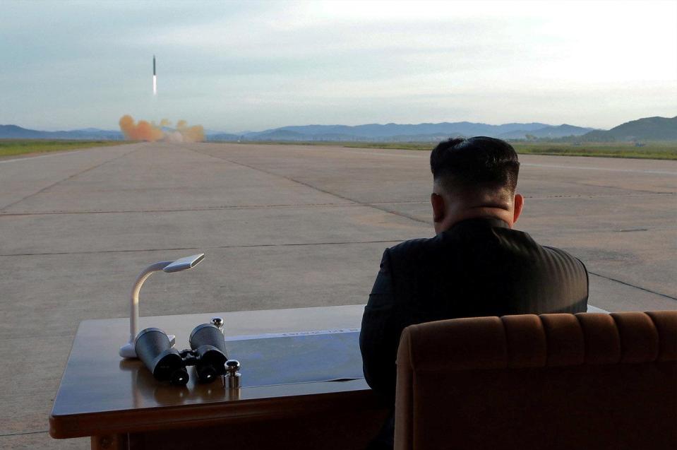  Kim supervises all his country;s controversial missile launches