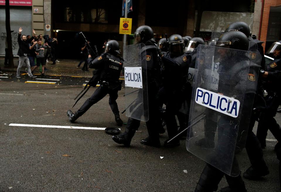  Riot police use shields and prepare themselves to hold back voters