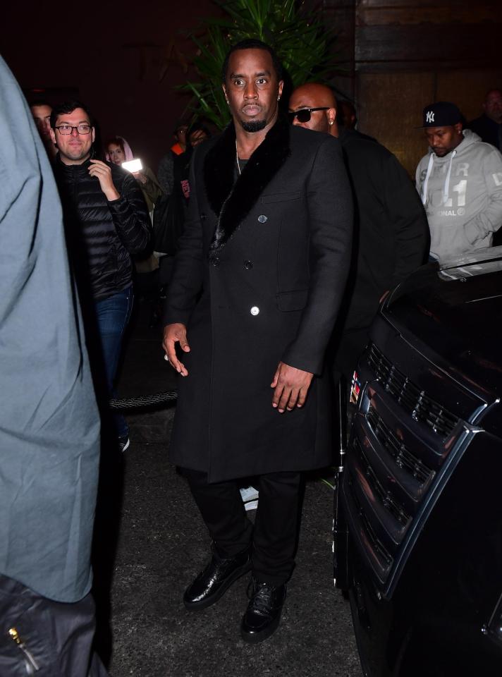  Diddy looked dapper in a knee-length black coat