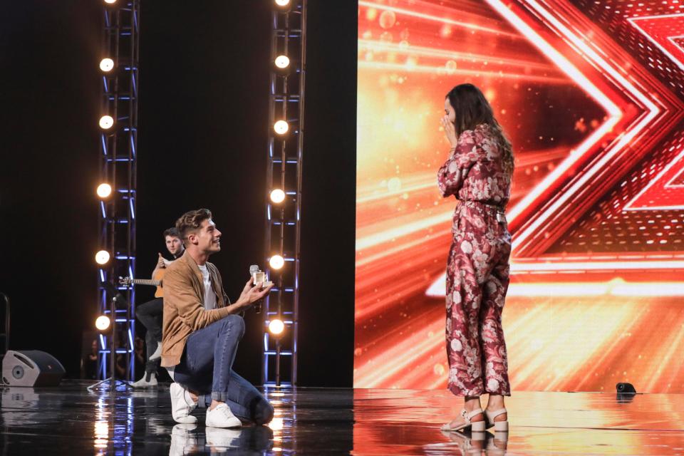  He introduced girlfriend Emma onto the stage and dropped to one knee